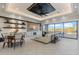 Bright living room with a modern ceiling fan, built-in shelving, and large windows with beautiful views, great for relaxing at 2317 N Steele Cir, Mesa, AZ 85207