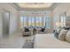 Bright and airy main bedroom, highlighted by a bay of windows and comfortable seating at 2317 N Steele Cir, Mesa, AZ 85207