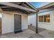 Covered back patio with extra storage area, perfect for relaxing or entertaining guests at 2827 E Willow Ave, Phoenix, AZ 85032