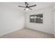 Empty bedroom with neutral carpet, white walls, and a window providing natural light at 2827 E Willow Ave, Phoenix, AZ 85032