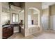 The main bathroom features a large tub, glass block window and natural light at 315 S Racine Ct, Gilbert, AZ 85296