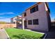 This home features a low-maintenance backyard with artificial turf and a covered patio, perfect for outdoor living at 35210 N 34Th Ln, Phoenix, AZ 85086