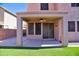 The covered patio is located off the backyard's artificial turf at 35210 N 34Th Ln, Phoenix, AZ 85086
