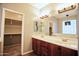 Double vanity sinks and a large mirror are featured in this bathroom at 35210 N 34Th Ln, Phoenix, AZ 85086
