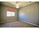 Bedroom with neutral carpet, window with custom shade and ceiling fan offers relaxation and privacy at 35210 N 34Th Ln, Phoenix, AZ 85086