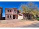 Two-story home with a well-maintained front yard and neutral color palette at 35210 N 34Th Ln, Phoenix, AZ 85086