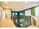 Upstairs hallway with carpet flooring, decorative railing, and windows provides natural light and appealing design at 35210 N 34Th Ln, Phoenix, AZ 85086