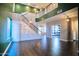 Expansive living area featuring a decorative staircase and modern light fixtures at 35210 N 34Th Ln, Phoenix, AZ 85086