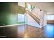 Bright room with high ceilings, decorative staircase, and modern flooring at 35210 N 34Th Ln, Phoenix, AZ 85086