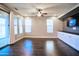 Bright and airy living room featuring hardwood floors, windows, and sliding glass door at 35210 N 34Th Ln, Phoenix, AZ 85086
