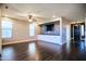 Bright living room features hardwood floors, a ceiling fan, and a built-in entertainment center at 35210 N 34Th Ln, Phoenix, AZ 85086