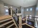 Spacious loft area with views of the living room below, and modern railings at 35210 N 34Th Ln, Phoenix, AZ 85086
