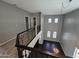Spacious loft area with views of the living room below, and modern railings at 35210 N 34Th Ln, Phoenix, AZ 85086