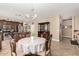 Dining area with chandelier opens to kitchen, complemented by a cabinet for storage at 35293 N Thurber Rd, San Tan Valley, AZ 85144