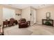 Open living space with tile floors, a leather recliner, a desk, and neutral paint at 35293 N Thurber Rd, San Tan Valley, AZ 85144