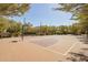 Neighborhood basketball court bordered by trees, providing a pleasant outdoor recreational area for residents at 3556 E Ivanhoe St, Gilbert, AZ 85295