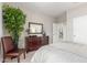 Bright bedroom featuring a large dresser with mirror and a view into the hall at 3751 N Hidden Canyon Dr, Florence, AZ 85132