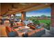 Comfortable outdoor lounge with cozy seating, offering views of the manicured golf course at 3751 N Hidden Canyon Dr, Florence, AZ 85132