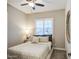 Bright bedroom featuring a ceiling fan and plantation shutters on the window for natural light at 4207 S Electron --, Mesa, AZ 85212