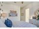 Comfortable bedroom with a white dresser, neutral walls, decorative accents and plush bedding at 4207 S Electron --, Mesa, AZ 85212