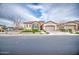 Inviting home showcasing a stone facade, well-kept lawn, and a two-car garage at 4207 S Electron --, Mesa, AZ 85212