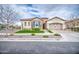 Charming single-story home with stone accents, manicured lawn, and inviting curb appeal at 4207 S Electron --, Mesa, AZ 85212