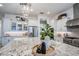Close-up of a kitchen island with granite countertops, pendant lighting, and modern decor at 4207 S Electron --, Mesa, AZ 85212