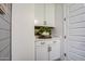 Well-organized laundry room with ample storage and stylish tile flooring, plus lots of drinking water at 4207 S Electron --, Mesa, AZ 85212