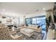 Spacious living room showcasing an open floor plan, plush seating, and seamless transition to an outdoor patio at 4207 S Electron --, Mesa, AZ 85212