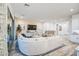 Elegant living room featuring a large sectional sofa, stylish decor, and abundant natural light at 4207 S Electron --, Mesa, AZ 85212