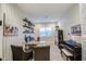 Well-designed home office featuring a large desk, shelving, comfortable seating and neutral decor at 4207 S Electron --, Mesa, AZ 85212