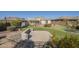Spacious backyard with a pool, putting green, and concrete patio for entertaining at 4243 S Hackberry Trl, Gold Canyon, AZ 85118