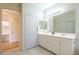 Spacious bathroom with double sinks and adjacent office at 4243 S Hackberry Trl, Gold Canyon, AZ 85118