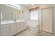 Bright bathroom with dual vanity, tub, and glass shower at 4243 S Hackberry Trl, Gold Canyon, AZ 85118