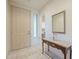 Entrance foyer featuring tile flooring, a decorative table, and an arched doorway leading to other rooms at 4243 S Hackberry Trl, Gold Canyon, AZ 85118