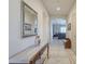Hallway view showcases tile floors, neutral wall paint, decorative mirror, and the layout of the home at 4243 S Hackberry Trl, Gold Canyon, AZ 85118