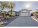 Charming single-story home featuring a well-maintained front yard with desert landscaping and a two-car garage at 4243 S Hackberry Trl, Gold Canyon, AZ 85118
