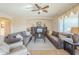 Spacious living room with laminate flooring, comfortable sofas, media center, and cozy lighting at 4243 S Hackberry Trl, Gold Canyon, AZ 85118