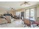 Open-concept living room seamlessly connects to the dining area with sliding glass doors at 4243 S Hackberry Trl, Gold Canyon, AZ 85118