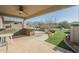 Inviting covered patio featuring a built-in grill, offering serene outdoor living at 4243 S Hackberry Trl, Gold Canyon, AZ 85118