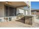 Relaxing outdoor patio area with a built-in grill and adjacent seating at 4243 S Hackberry Trl, Gold Canyon, AZ 85118