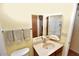 Bathroom vanity featuring an enclosed shower and a large folding mirror at 4328 E Capri Ave # 171, Mesa, AZ 85206