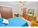 Bedroom featuring a comfortable bed, lots of storage, and neutral carpet at 4328 E Capri Ave # 171, Mesa, AZ 85206