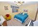 Bright bedroom with a ceiling fan, comfortable bed, and sunny yellow walls at 4328 E Capri Ave # 171, Mesa, AZ 85206