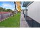 Well-maintained community exterior with lush green grass and a sidewalk for walking, showcasing curb appeal at 4328 E Capri Ave # 171, Mesa, AZ 85206