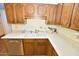 Fully equipped kitchen with stainless steel appliances, wood cabinets, and ample counter space at 4328 E Capri Ave # 171, Mesa, AZ 85206
