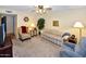 Comfortable living room with cozy seating, neutral carpet, and a warm atmosphere at 4328 E Capri Ave # 171, Mesa, AZ 85206