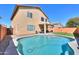 Large private swimming pool and covered patio create an outdoor oasis in this home's backyard at 44115 W Palmen Dr, Maricopa, AZ 85138