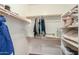 Walk-in closet providing ample storage with rods and shelves at 44115 W Palmen Dr, Maricopa, AZ 85138