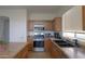 Bright kitchen with stainless steel appliances, countertops, and ample storage, perfect for cooking at 44115 W Palmen Dr, Maricopa, AZ 85138